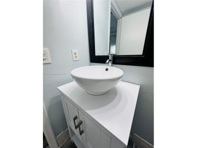 Bright and spacious corner unit in the desirable Century Village on Flamingo Lakes Country Club in Florida - for sale on GolfHomes.com, golf home, golf lot