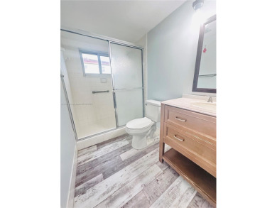 Bright and spacious corner unit in the desirable Century Village on Flamingo Lakes Country Club in Florida - for sale on GolfHomes.com, golf home, golf lot