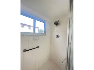 Bright and spacious corner unit in the desirable Century Village on Flamingo Lakes Country Club in Florida - for sale on GolfHomes.com, golf home, golf lot