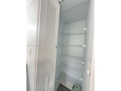 Bright and spacious corner unit in the desirable Century Village on Flamingo Lakes Country Club in Florida - for sale on GolfHomes.com, golf home, golf lot