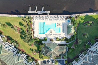 Experience luxury and tranquility in this fully furnished on Barefoot Resort and Golf Club  in South Carolina - for sale on GolfHomes.com, golf home, golf lot