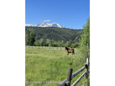 A beautiful corner lot location on a stream in the one-of-a-kind on Ranch at Roaring Fork Golf Course in Colorado - for sale on GolfHomes.com, golf home, golf lot