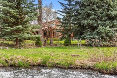 A beautiful corner lot location on a stream in the one-of-a-kind on Ranch at Roaring Fork Golf Course in Colorado - for sale on GolfHomes.com, golf home, golf lot