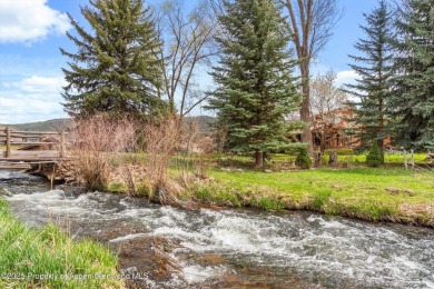 A beautiful corner lot location on a stream in the one-of-a-kind on Ranch at Roaring Fork Golf Course in Colorado - for sale on GolfHomes.com, golf home, golf lot