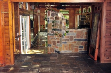 This unique lake home features large windows, offering on Lake Kiowa Golf Course in Texas - for sale on GolfHomes.com, golf home, golf lot