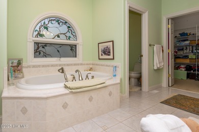 Welcome to this elegant, all-brick custom home built by on Pinewild Country Club of Pinehurst in North Carolina - for sale on GolfHomes.com, golf home, golf lot