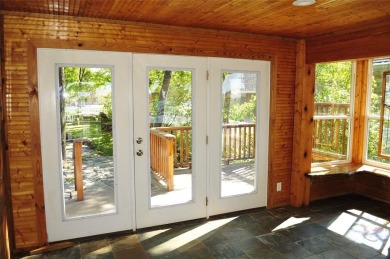 This unique lake home features large windows, offering on Lake Kiowa Golf Course in Texas - for sale on GolfHomes.com, golf home, golf lot