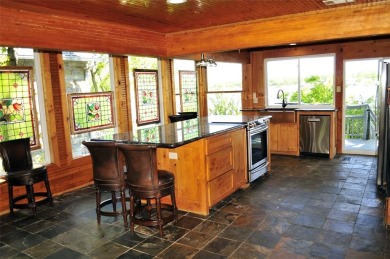 This unique lake home features large windows, offering on Lake Kiowa Golf Course in Texas - for sale on GolfHomes.com, golf home, golf lot