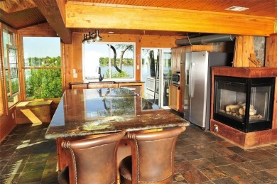 This unique lake home features large windows, offering on Lake Kiowa Golf Course in Texas - for sale on GolfHomes.com, golf home, golf lot