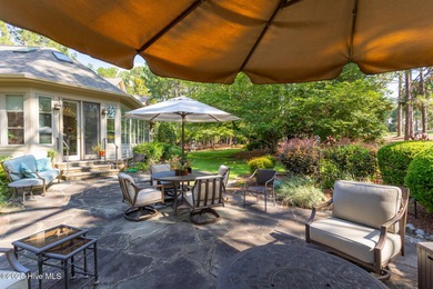 Welcome to this elegant, all-brick custom home built by on Pinewild Country Club of Pinehurst in North Carolina - for sale on GolfHomes.com, golf home, golf lot