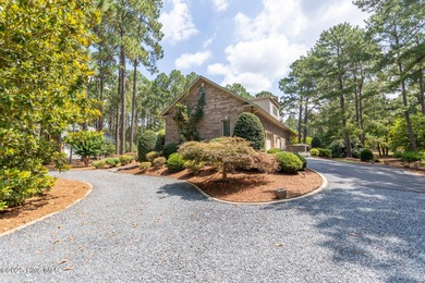 Welcome to this elegant, all-brick custom home built by on Pinewild Country Club of Pinehurst in North Carolina - for sale on GolfHomes.com, golf home, golf lot