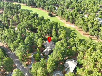 Welcome to this elegant, all-brick custom home built by on Pinewild Country Club of Pinehurst in North Carolina - for sale on GolfHomes.com, golf home, golf lot