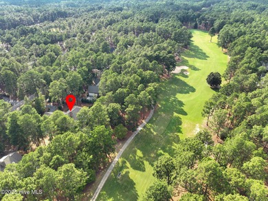Welcome to this elegant, all-brick custom home built by on Pinewild Country Club of Pinehurst in North Carolina - for sale on GolfHomes.com, golf home, golf lot
