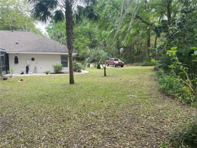 Stunning 4- bedroom pool home in a prime family friendly on Rainbow Springs Golf and Country Club in Florida - for sale on GolfHomes.com, golf home, golf lot