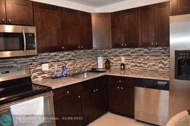 LOVELY CONDO IN QUIET ALL AGES GATED COMMUNITY! INVESTOR on Inverrary Country Club in Florida - for sale on GolfHomes.com, golf home, golf lot