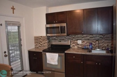 LOVELY CONDO IN QUIET ALL AGES GATED COMMUNITY! INVESTOR on Inverrary Country Club in Florida - for sale on GolfHomes.com, golf home, golf lot