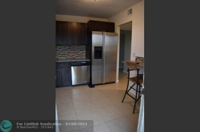 LOVELY CONDO IN QUIET ALL AGES GATED COMMUNITY! INVESTOR on Inverrary Country Club in Florida - for sale on GolfHomes.com, golf home, golf lot