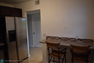 LOVELY CONDO IN QUIET ALL AGES GATED COMMUNITY! INVESTOR on Inverrary Country Club in Florida - for sale on GolfHomes.com, golf home, golf lot