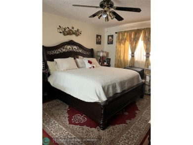LOVELY CONDO IN QUIET ALL AGES GATED COMMUNITY! INVESTOR on Inverrary Country Club in Florida - for sale on GolfHomes.com, golf home, golf lot