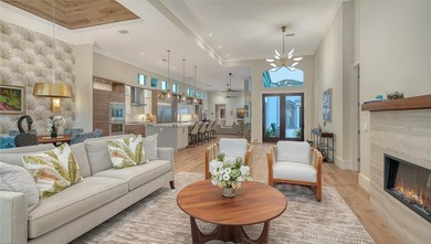 Situated within the gated Queens Harbour enclave of Bay Isles on Longboat Key Golf Club Resort in Florida - for sale on GolfHomes.com, golf home, golf lot