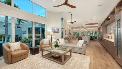 Situated within the gated Queens Harbour enclave of Bay Isles on Longboat Key Golf Club Resort in Florida - for sale on GolfHomes.com, golf home, golf lot