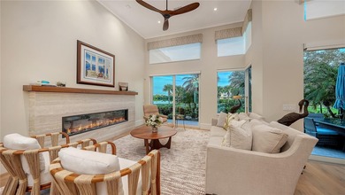 Situated within the gated Queens Harbour enclave of Bay Isles on Longboat Key Golf Club Resort in Florida - for sale on GolfHomes.com, golf home, golf lot