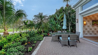 Situated within the gated Queens Harbour enclave of Bay Isles on Longboat Key Golf Club Resort in Florida - for sale on GolfHomes.com, golf home, golf lot