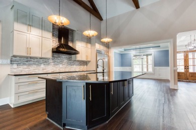 This exquisite custom built home offers 4 spacious bedrooms and on Harbor Club Golf and Country Club in Georgia - for sale on GolfHomes.com, golf home, golf lot
