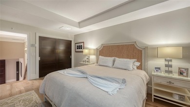 Situated within the gated Queens Harbour enclave of Bay Isles on Longboat Key Golf Club Resort in Florida - for sale on GolfHomes.com, golf home, golf lot