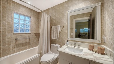 Situated within the gated Queens Harbour enclave of Bay Isles on Longboat Key Golf Club Resort in Florida - for sale on GolfHomes.com, golf home, golf lot