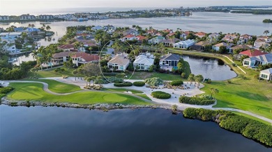 Situated within the gated Queens Harbour enclave of Bay Isles on Longboat Key Golf Club Resort in Florida - for sale on GolfHomes.com, golf home, golf lot