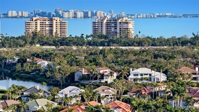 Situated within the gated Queens Harbour enclave of Bay Isles on Longboat Key Golf Club Resort in Florida - for sale on GolfHomes.com, golf home, golf lot
