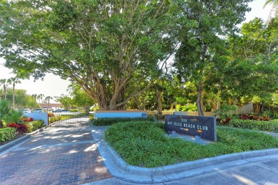 Situated within the gated Queens Harbour enclave of Bay Isles on Longboat Key Golf Club Resort in Florida - for sale on GolfHomes.com, golf home, golf lot
