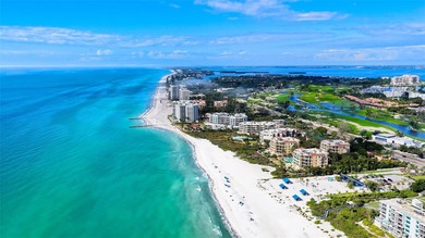 Situated within the gated Queens Harbour enclave of Bay Isles on Longboat Key Golf Club Resort in Florida - for sale on GolfHomes.com, golf home, golf lot