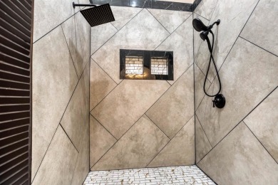 This exquisite custom built home offers 4 spacious bedrooms and on Harbor Club Golf and Country Club in Georgia - for sale on GolfHomes.com, golf home, golf lot