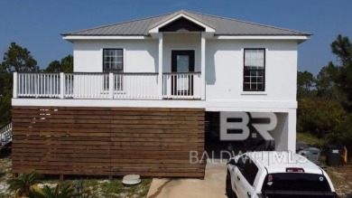 Ready for rental season with this versatile beach house! Totally on Kiva Dunes Golf Club in Alabama - for sale on GolfHomes.com, golf home, golf lot