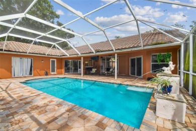 Stunning 4BR/2.5BA pool home on an oversized lot in the gated on East Lake Woodlands Country Club in Florida - for sale on GolfHomes.com, golf home, golf lot