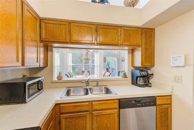 Ground floor condo in the highly desirable East Lake Woodlands on East Lake Woodlands Country Club in Florida - for sale on GolfHomes.com, golf home, golf lot
