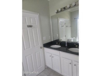 A beach getaway with three bedrooms PLUS an income producing on Sea Trail Golf Resort in North Carolina - for sale on GolfHomes.com, golf home, golf lot