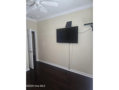 A beach getaway with three bedrooms PLUS an income producing on Sea Trail Golf Resort in North Carolina - for sale on GolfHomes.com, golf home, golf lot
