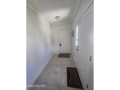 A beach getaway with three bedrooms PLUS an income producing on Sea Trail Golf Resort in North Carolina - for sale on GolfHomes.com, golf home, golf lot