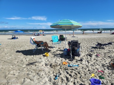 A beach getaway with three bedrooms PLUS an income producing on Sea Trail Golf Resort in North Carolina - for sale on GolfHomes.com, golf home, golf lot
