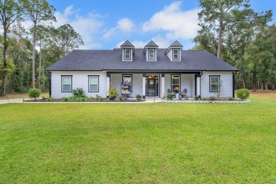 Discover this stunning, one-of-a-kind home built by Pafford on Wildwood Country Club in Florida - for sale on GolfHomes.com, golf home, golf lot