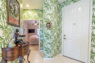 Tucked away in the heart of Pelican Marsh, this beautifully on  in Florida - for sale on GolfHomes.com, golf home, golf lot