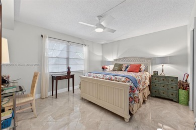 Welcome to your perfect Florida retreat! This beautifully on Wynmoor Golf Course in Florida - for sale on GolfHomes.com, golf home, golf lot