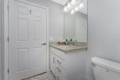 Sweeping golf course AND water views abound from this desirable on Heritage Landing Golf  in Florida - for sale on GolfHomes.com, golf home, golf lot