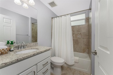 Sweeping golf course AND water views abound from this desirable on Heritage Landing Golf  in Florida - for sale on GolfHomes.com, golf home, golf lot