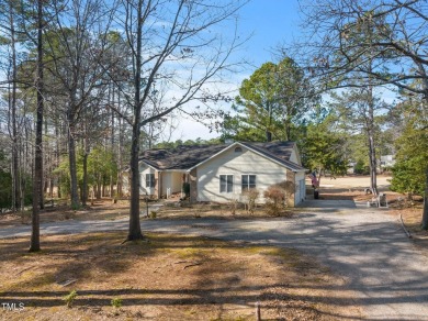 Beautiful 3-bedroom, 2-bath ranch-style home that sits on a on Carolina Trace Country Club in North Carolina - for sale on GolfHomes.com, golf home, golf lot