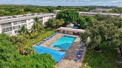 Welcome to your perfect Florida retreat! This beautifully on Wynmoor Golf Course in Florida - for sale on GolfHomes.com, golf home, golf lot