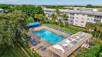 Welcome to your perfect Florida retreat! This beautifully on Wynmoor Golf Course in Florida - for sale on GolfHomes.com, golf home, golf lot